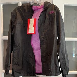 Youth NorthFace Rain jacket. New. XL. Black and purple.